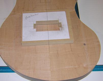 Jig for the bridge pickup is taped in place.