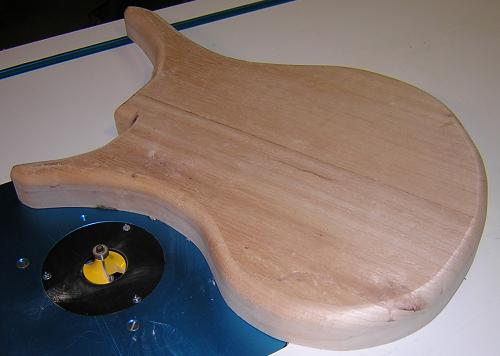 The back edges of the guitar body are rounded over.