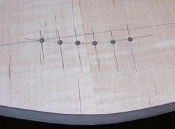 String through the body holes have been drilled.