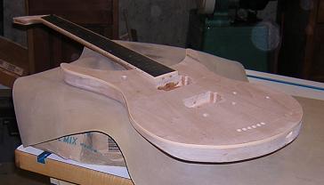 Supporting the neck for fret installation.