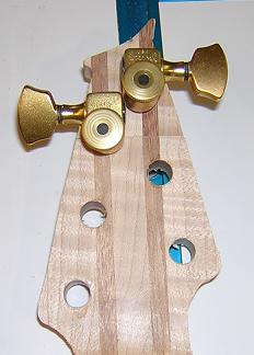 Top two tuning machines interfere with each other.