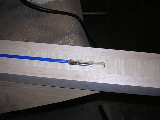Widening the adjustment head area of the truss rod channel.