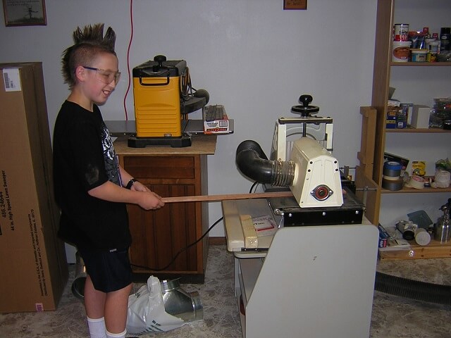 Tundra Boy sanding the mahogany laminate to size.