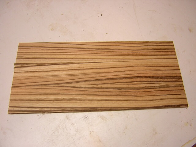 The sanded headstock veneer.