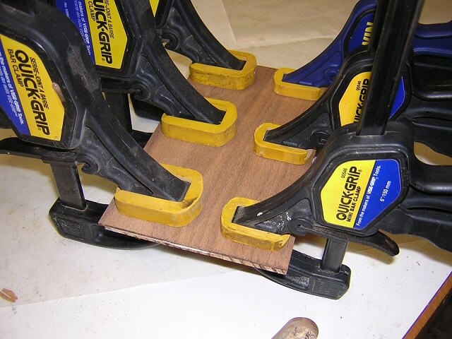 Adding a layer of walnut veneer to the headstock veneer.