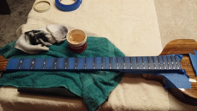 Crowning and polishing the frets.