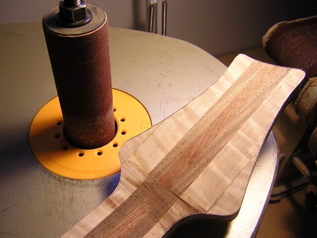 Sanding the headstock to final shape.