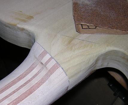 Fine-tuning the transition with sandpaper.