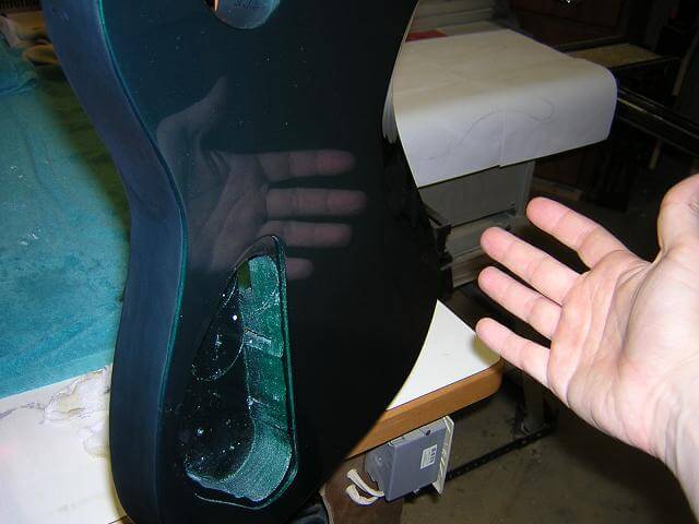 A demonstration of just how shiny the guitar has become.