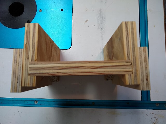 Guide pieces on each side of the router sled.