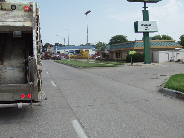 An incredibly smelly garbage truck, and an incredibly large semi load.