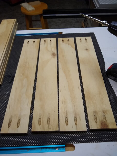 The pocket holes drilled in the drawer sides.