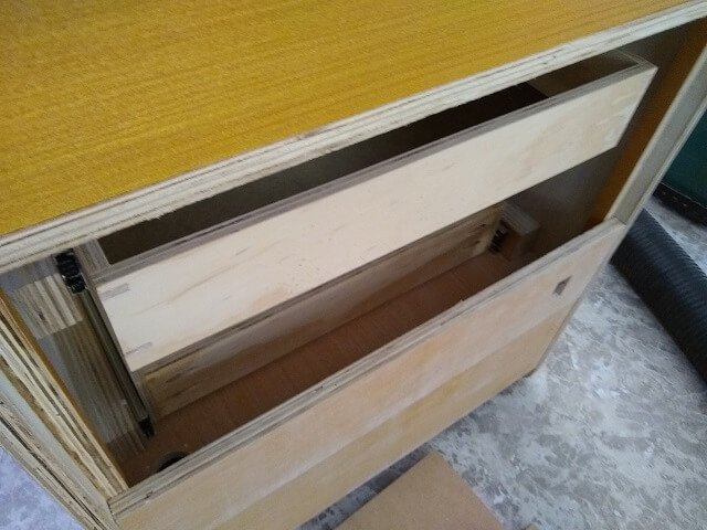 Checking the clearance at the back of the lower drawer.