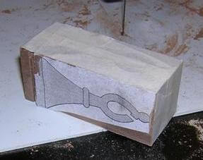 Taping the scrap pieces back in place.