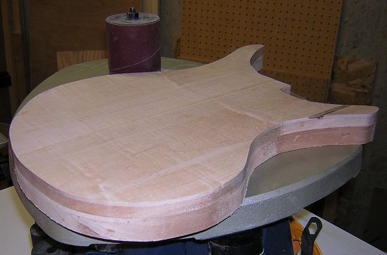 Sanding the edges of the freshly trimmed body.