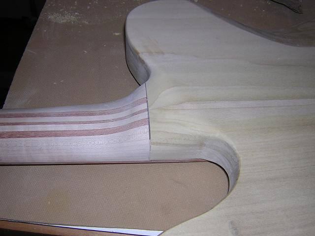 Carving the neck heel.