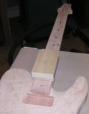 Sanding the radius into the fretboard.