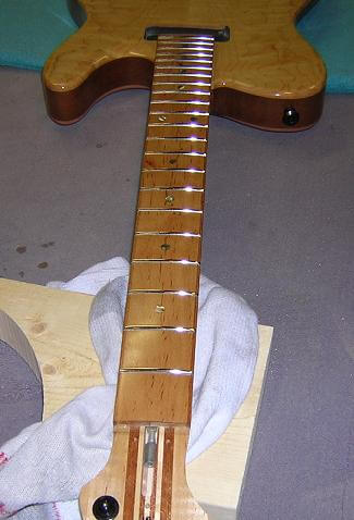 Admiring the shiny frets.