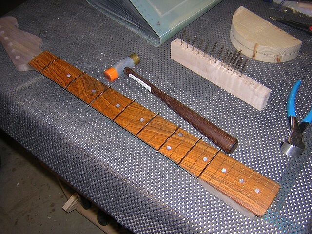 Installing the frets.