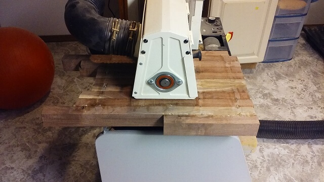 Running the body through the wide belt sander.