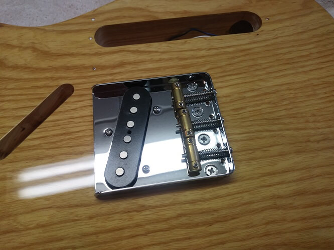 Installing the bridge and bridge pickup.