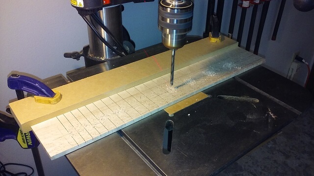 Drilling the holes for the dot inlays.