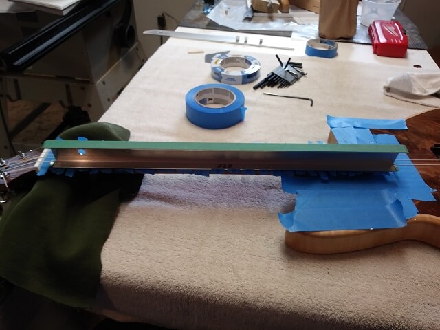 Leveling the frets.