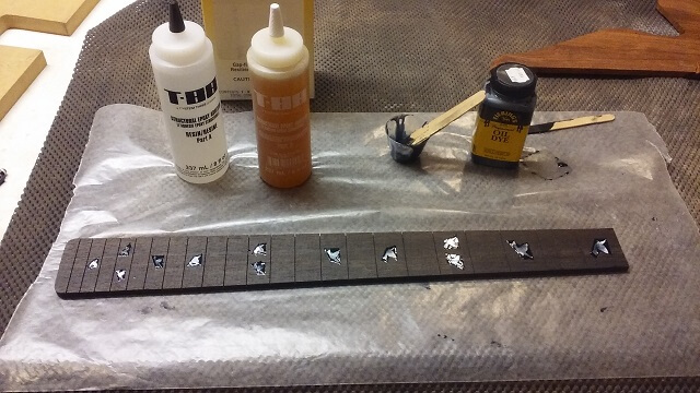 Gluing the inlays in place.