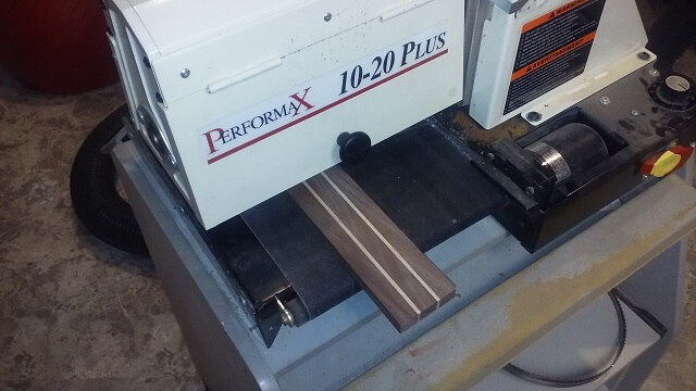 Sanding the face of the headstock.