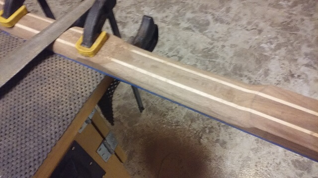 Carving the heel end of the neck.