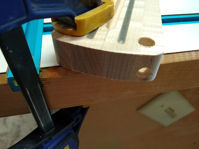 A hole to let the LED wire pass into the body.