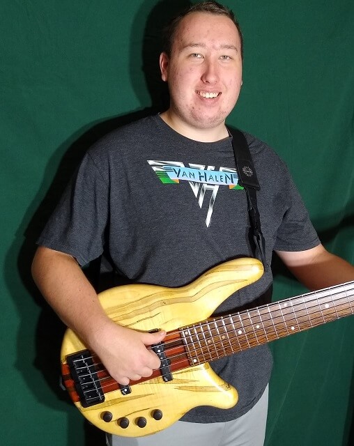 A closeup of the Tundra Boy with his instrument.