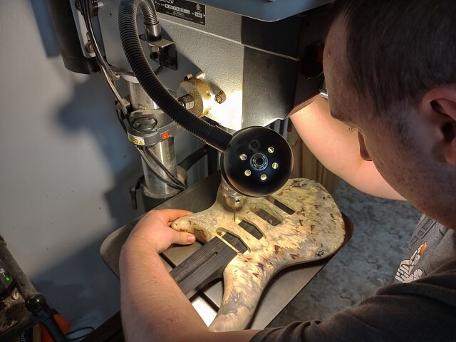 Drilling the pickup mounting holes.