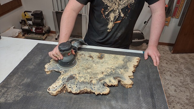 Removing the deep scratches left by the drum sander.