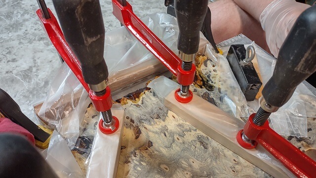 Filling the live edge of the buckeye with resin.