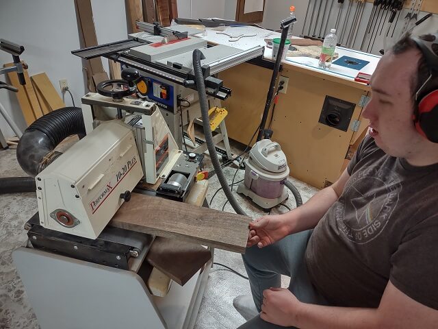 Sanding the body wings to final thickness.