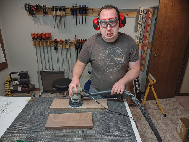 Sanding the body wings to remove the drum sander scratches.