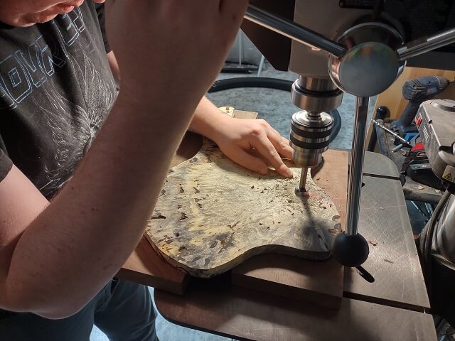 Drilling countersinks for the volume and tone knobs.