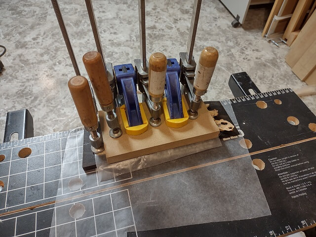 Gluing the buckeye veneer to the headstock.