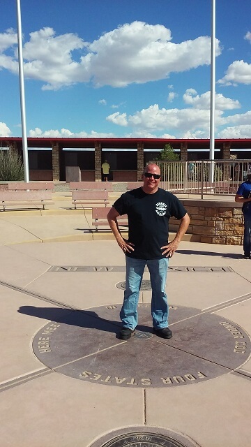 Jon standing on the four corners..