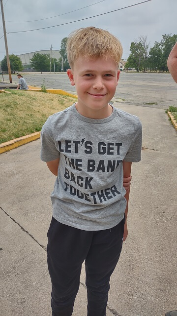 A German boy with a Blues Brothers inspired t-shirt.