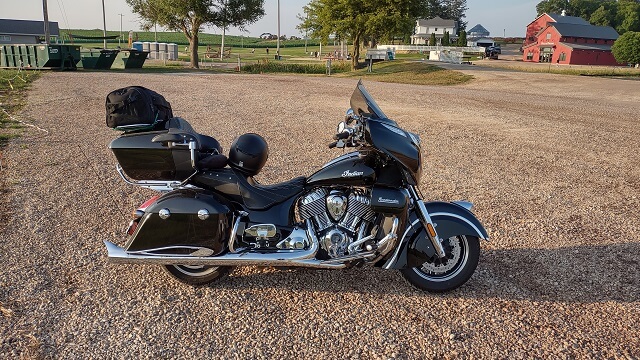 My motorcycle with a rear tire too low to safely ride sitting at the Field of Dreams movie site in Dyersville, IA.