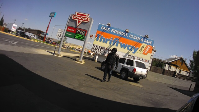 Walking back to the motorcycle after pushing a lady's car out of the way.