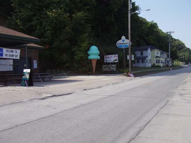 A giant ice cream cone and an old Standard sign in Lansing, IA