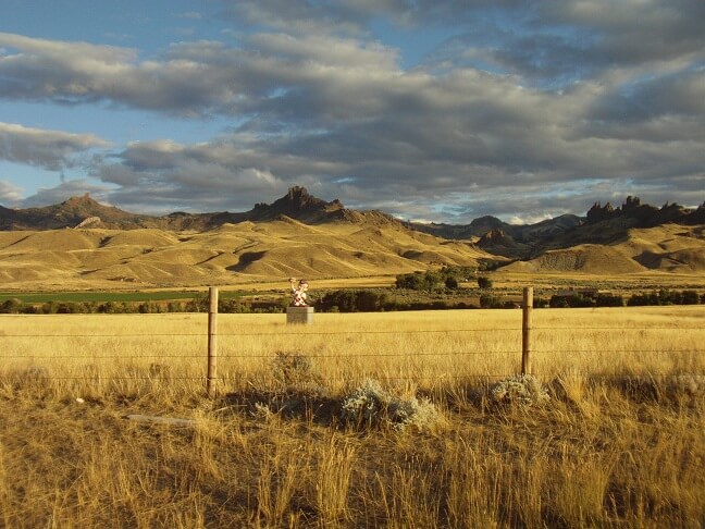 A Big Boy statue in the middle of a field.