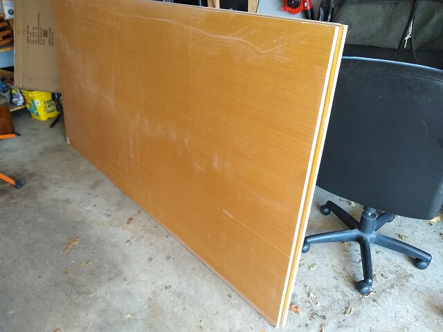 Three sheets of plywood that will become the cabinet.