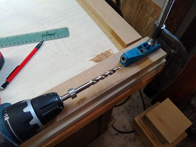 Drilling the pocket holes in the bezel pieces.