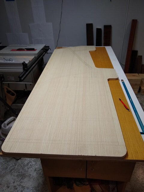 Marking the cabinet shape on the second piece.