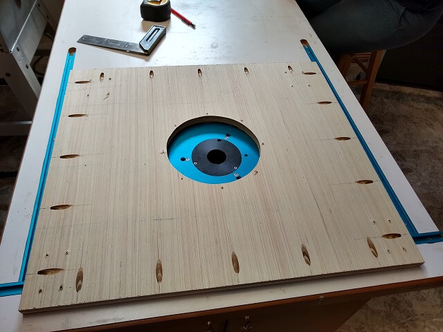 The pocket holes drilled in the subwoofer bottom.