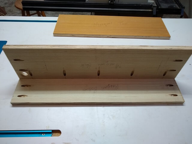 The pocket screw holes drilled for the marquee assembly.